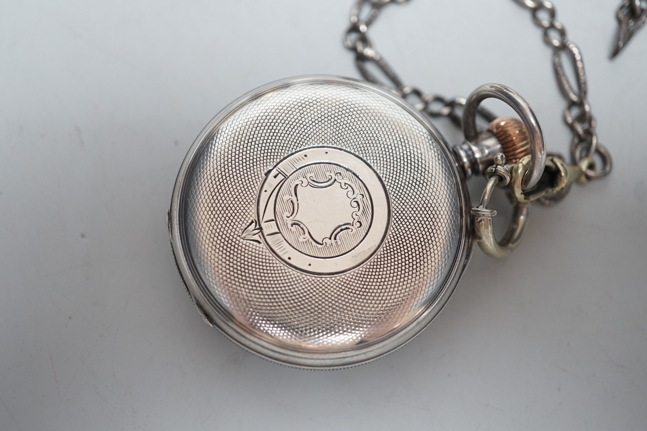 Small silverware, including a George V cream jug and matching sugar bowl, a mustard pot and matching pepper pot, silver serviette ring and a gentleman’s silver pocket watch and chain.
